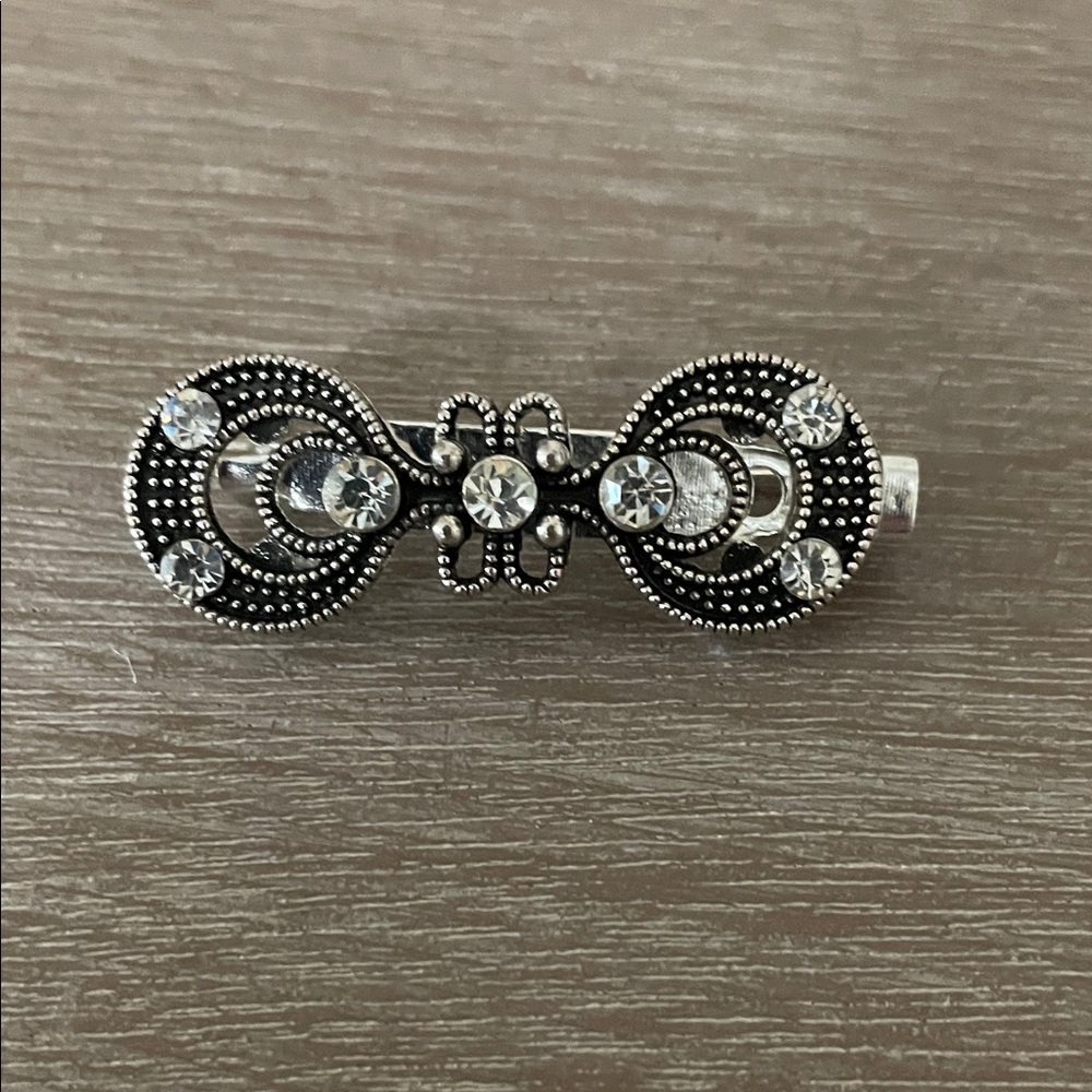 Elegant Silver and Black Brooch